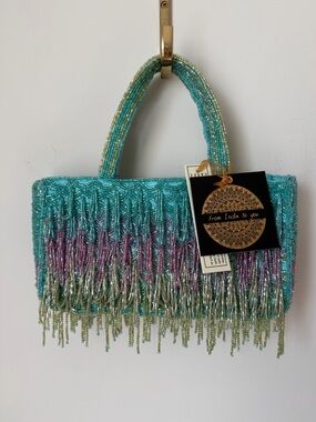 Viral beaded rectangle draped fringe mermaid style hand bag